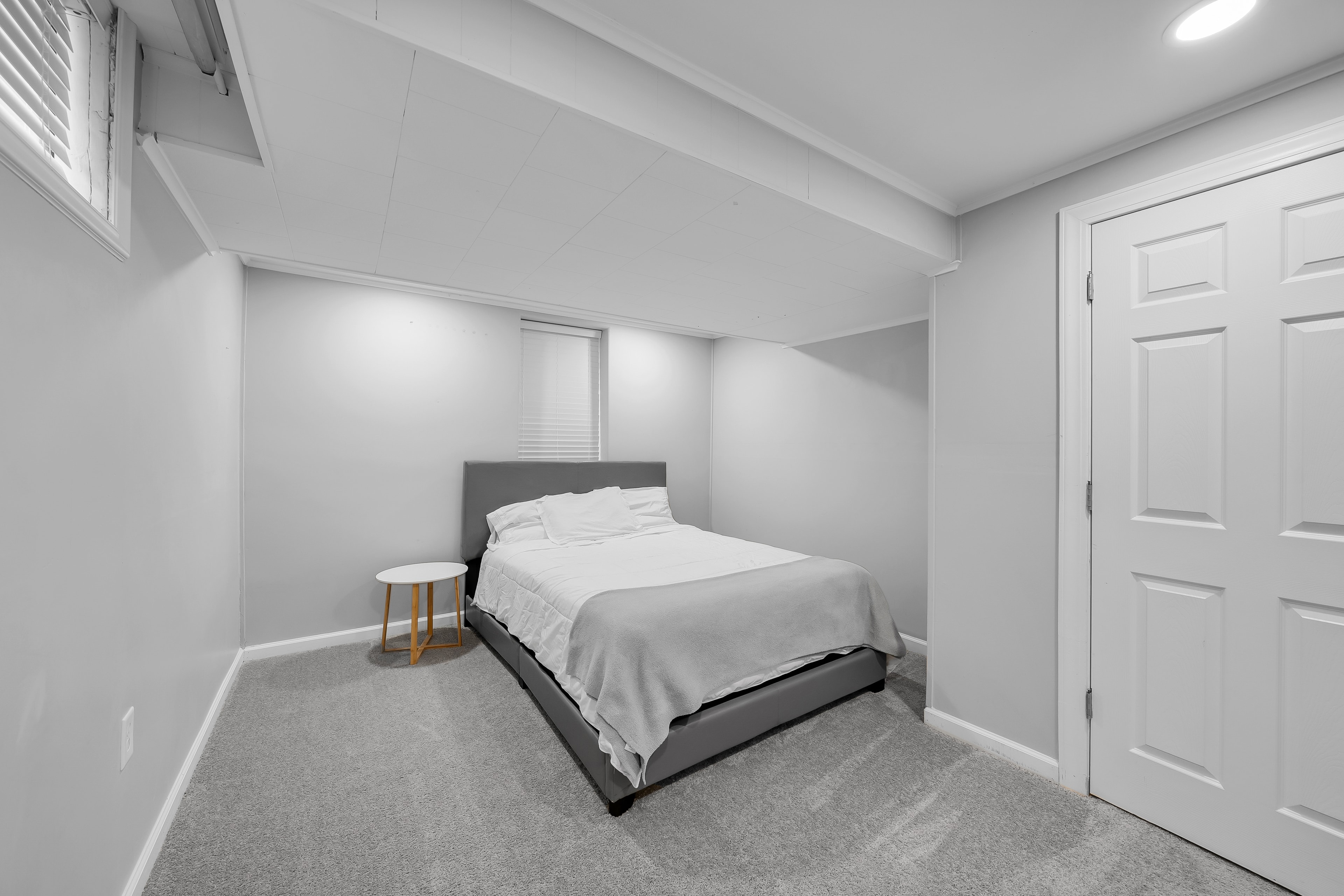 RCVRY HOUSE basement bedroom with carpet and closet door