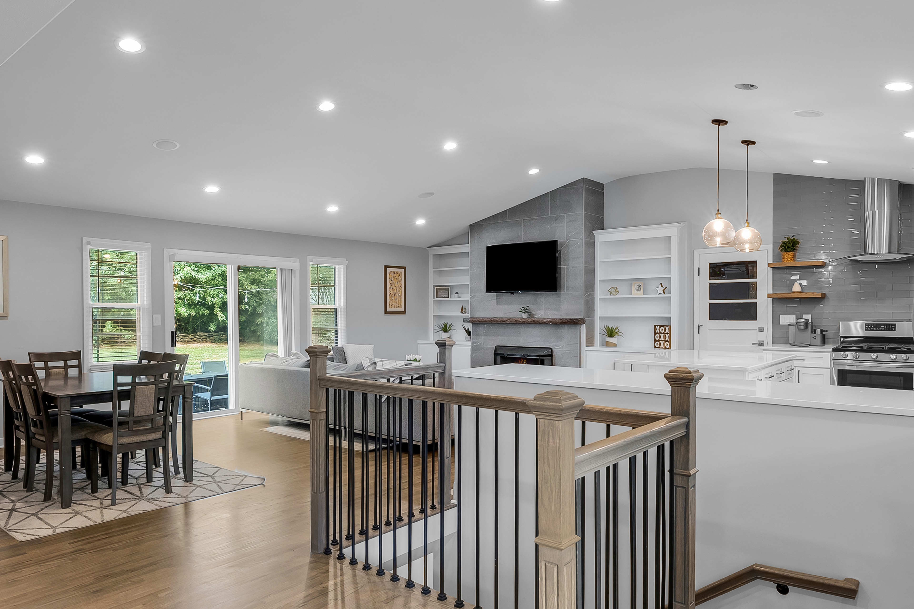 RCVRY HOUSE dining area and living room from staircase landing