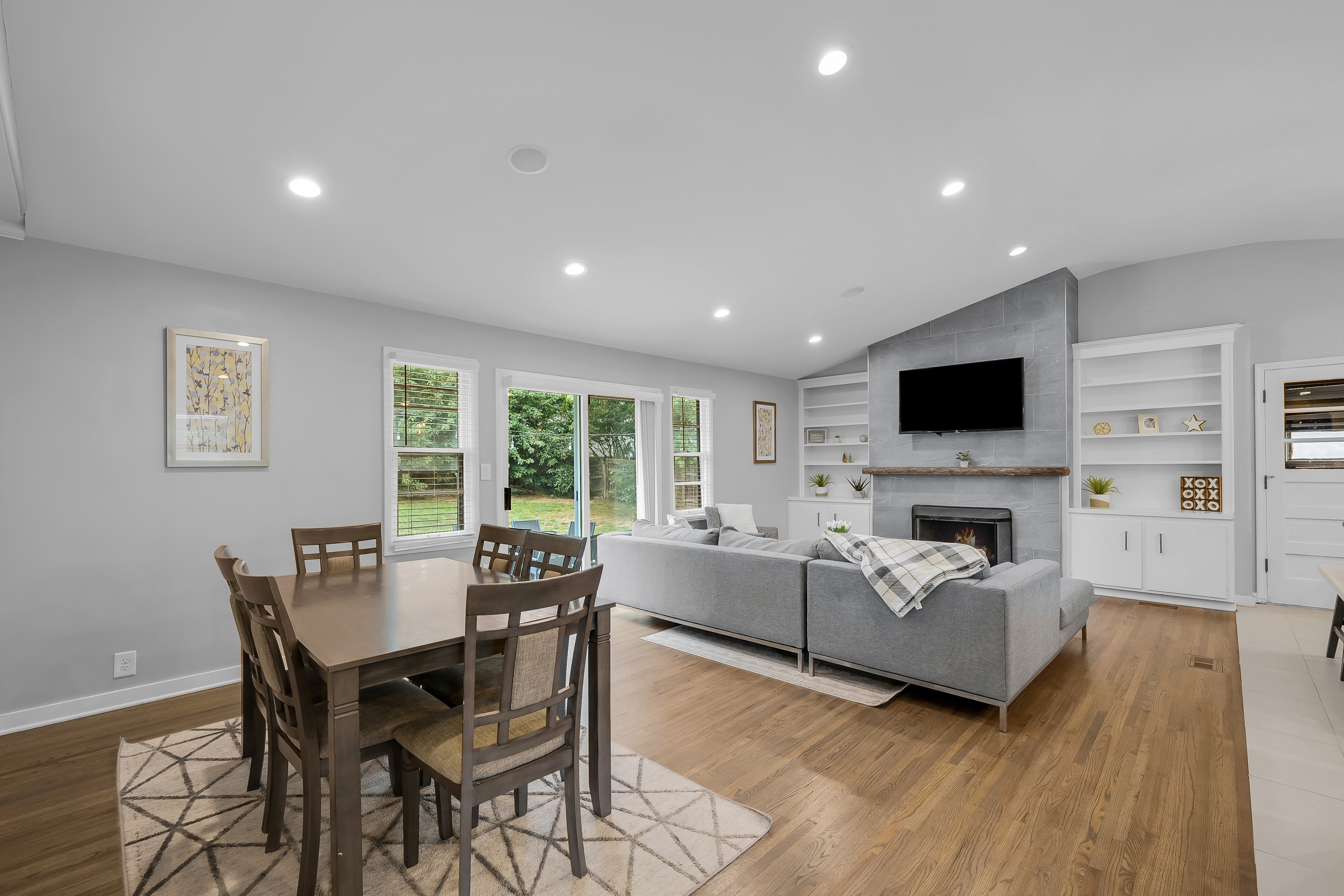 RCVRY HOUSE dining table with living room and backyard windows