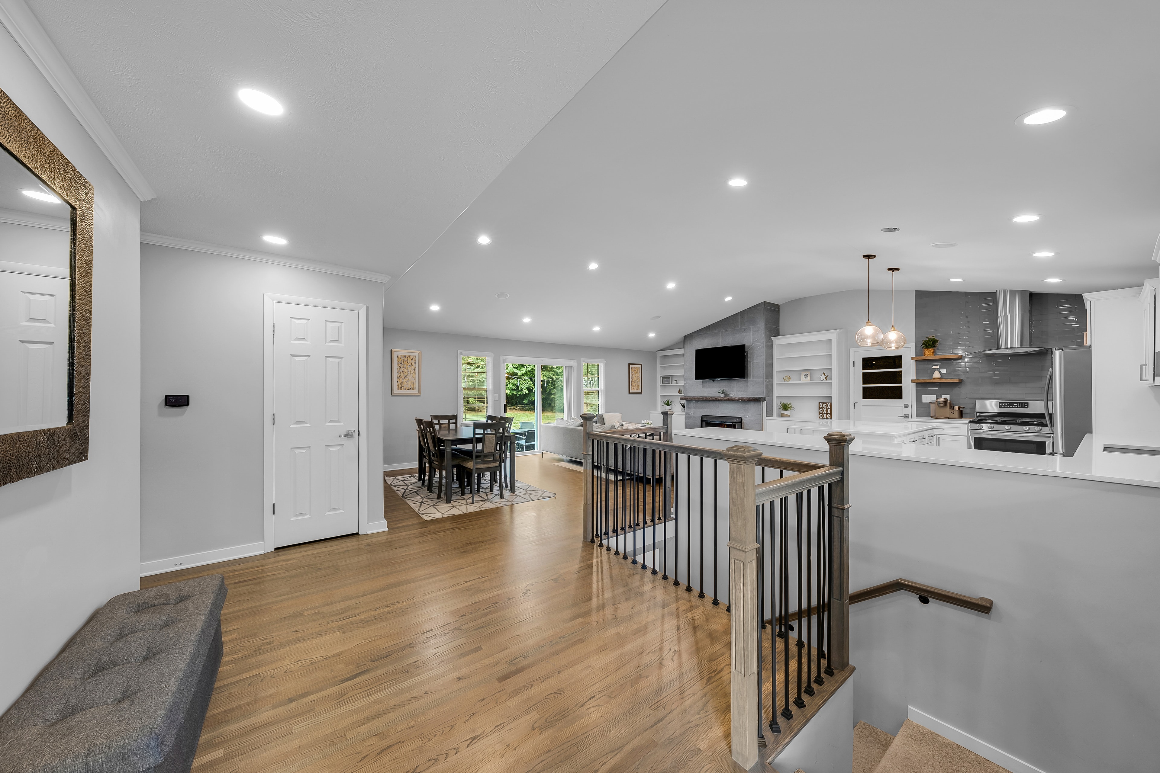RCVRY HOUSE entry foyer looking toward open floor plan living and dining