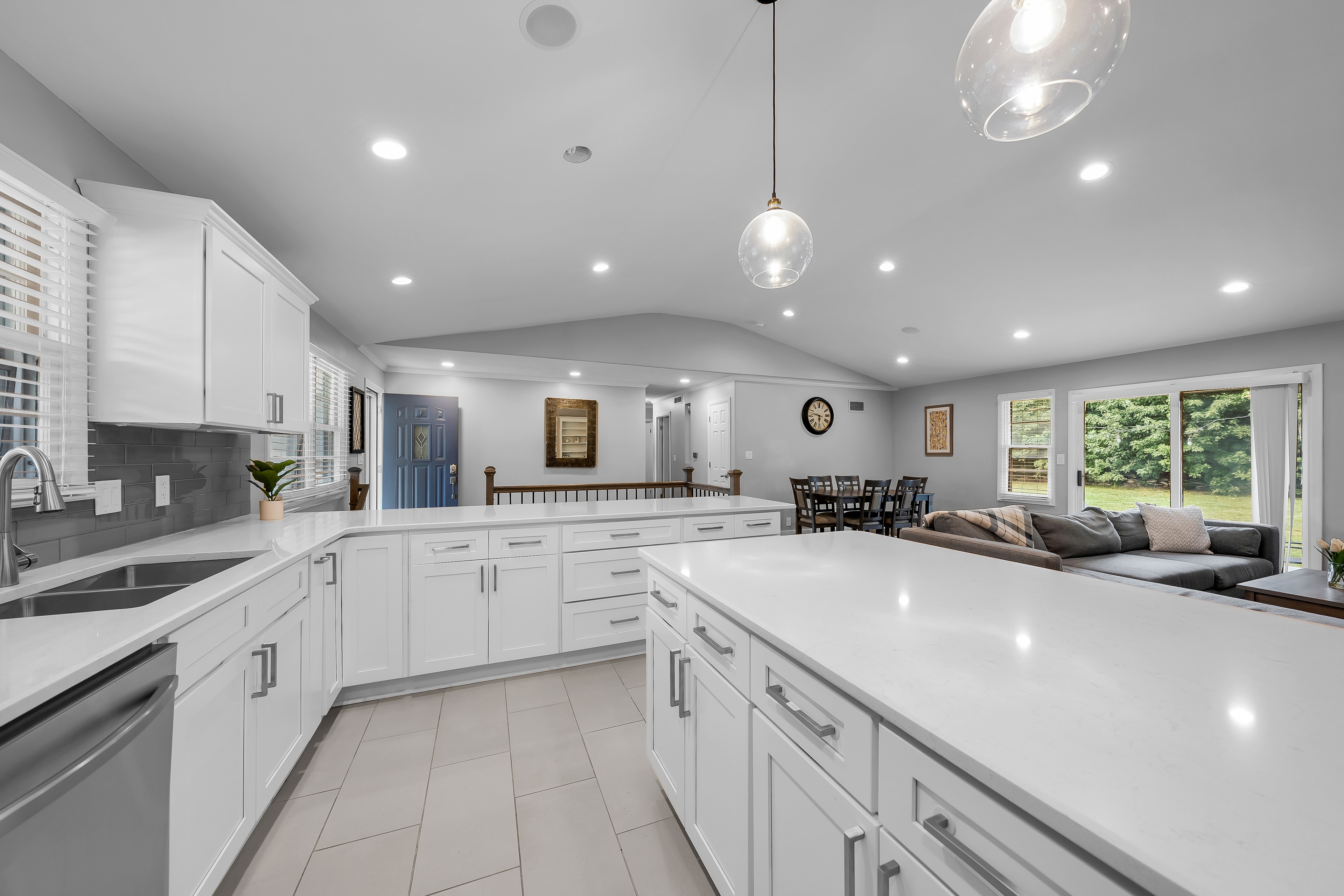 RCVRY HOUSE kitchen from sink side with open living room beyond