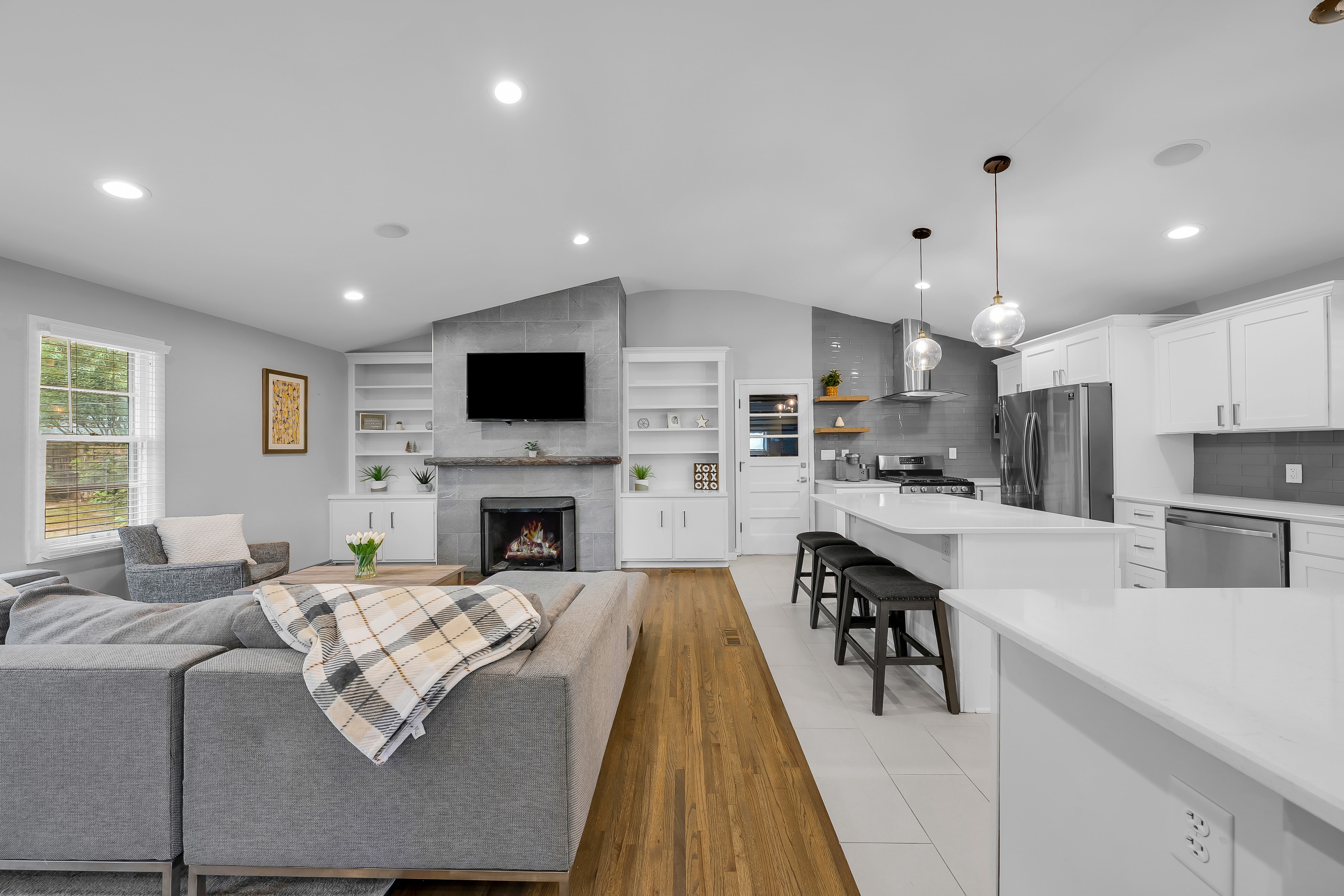 RCVRY HOUSE open-concept living room and kitchen — wide angle