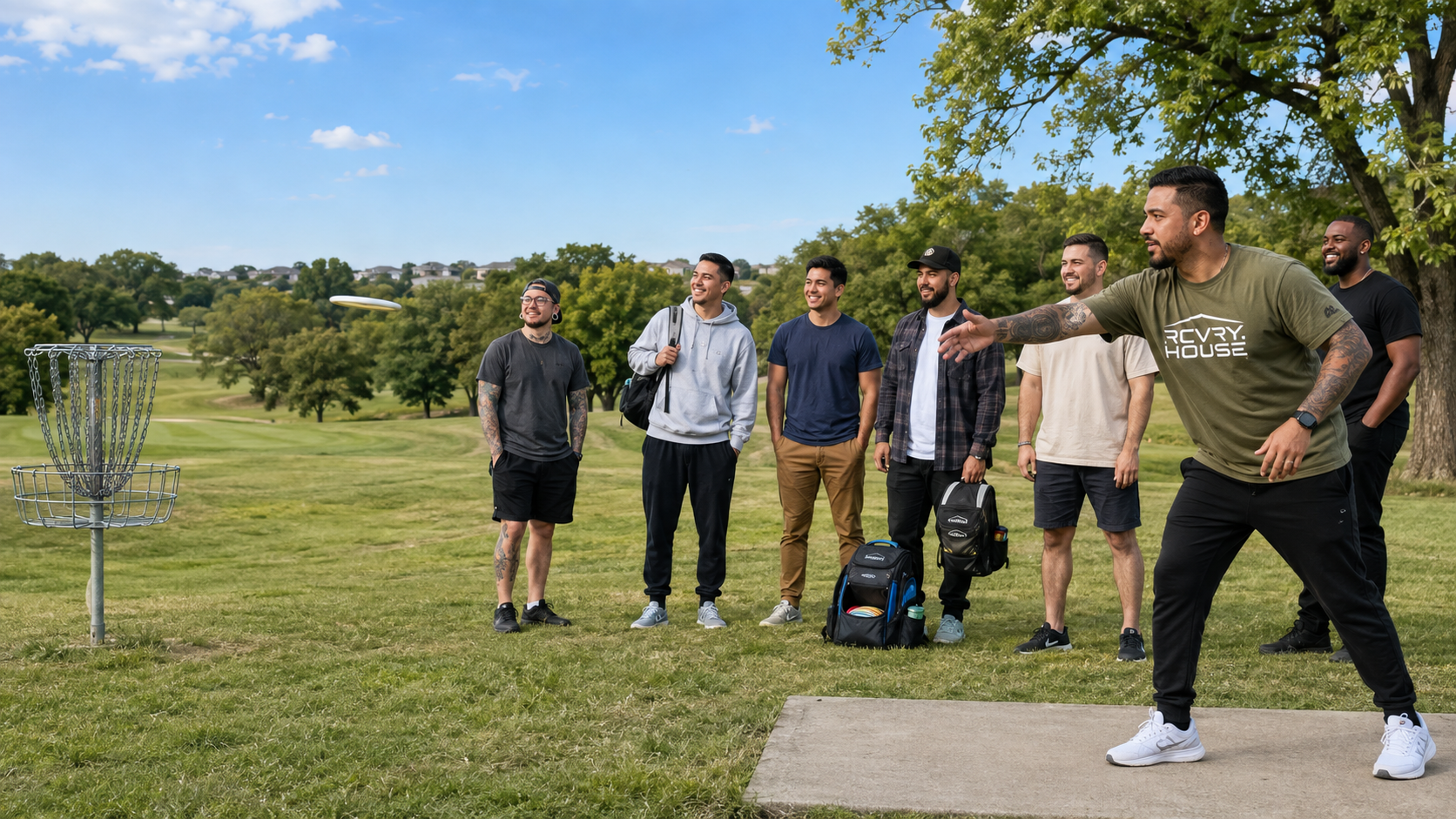 Program participants playing disc golf in Omaha